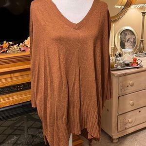 Tunic sweater with ribbed detail.